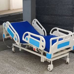 Five-function motorised ICU bed with tilt and collapsible polymer side rails