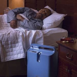 Continuous-flow oxygen concentrator with humidifier bottle and flow meter
