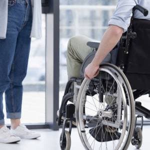 Folding manual wheelchair with removable arm rests and swing-away footrests
